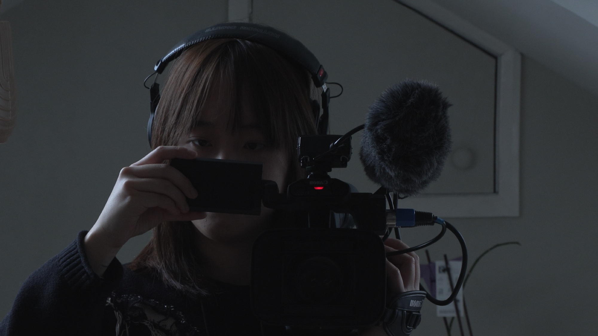 Yufan Ran operating a video camera